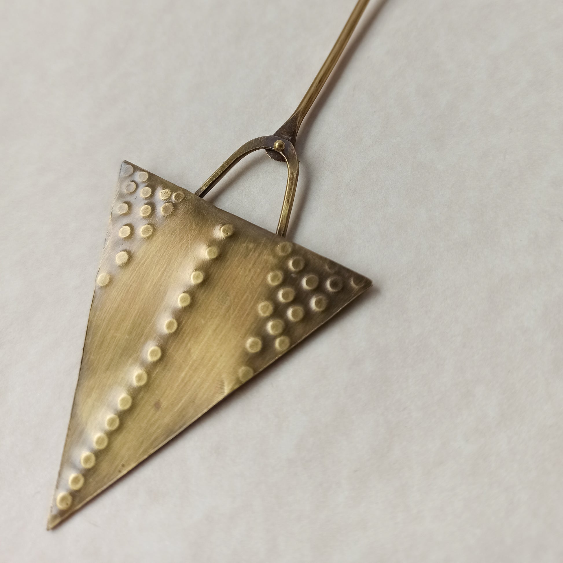 Handmade long necklace from oxidized brass. The center part is made from handtextured brass sheet and the chain is handmade from brass wire. The part that rests on the neck is from black satin cord. A lariat style totally handmade necklace ideal to make your outfit stand out.