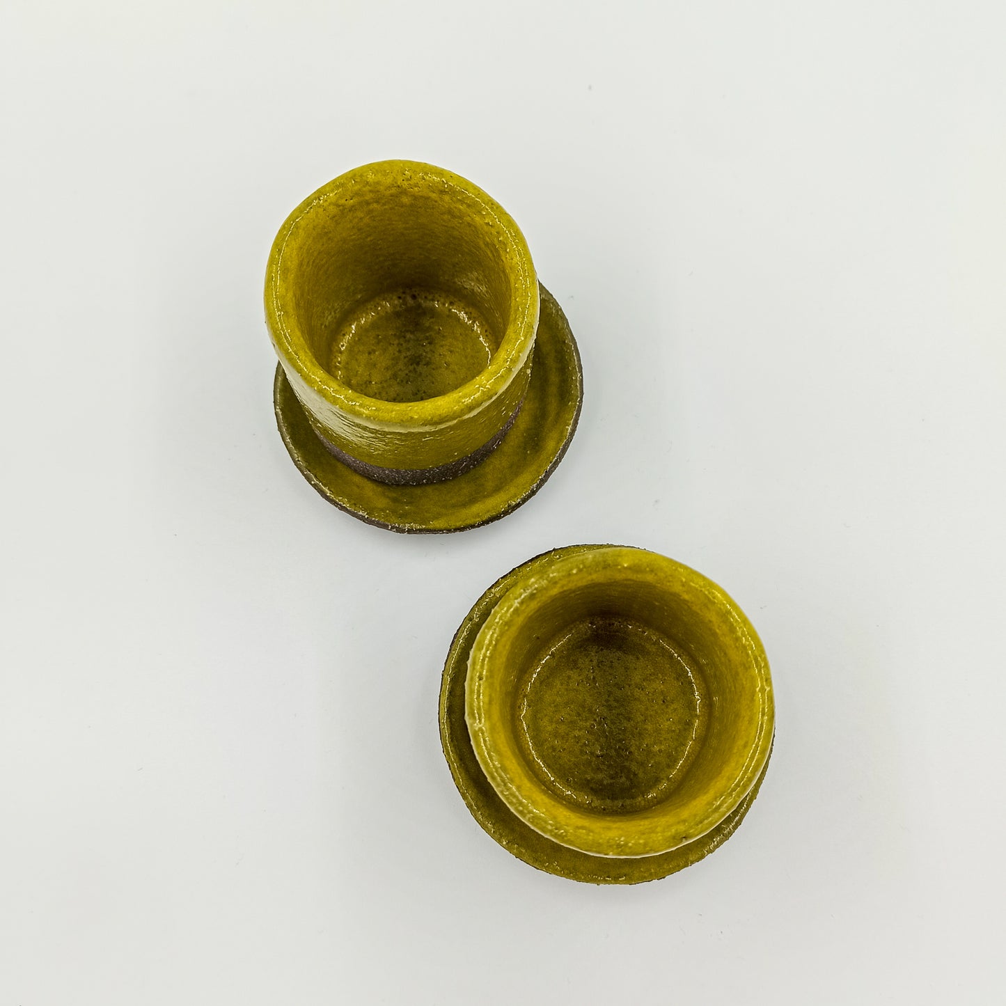 Handbuilt ceramic espresso cup in yellow