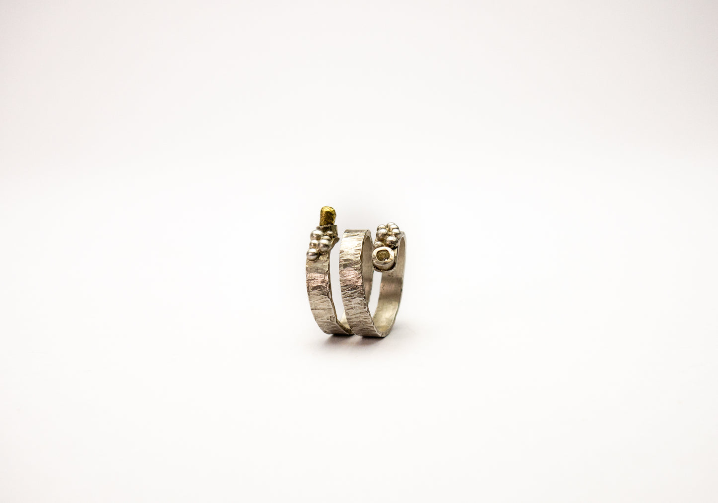 Statement sterling silver wraparound ring with silver granules and swarovski crystal.