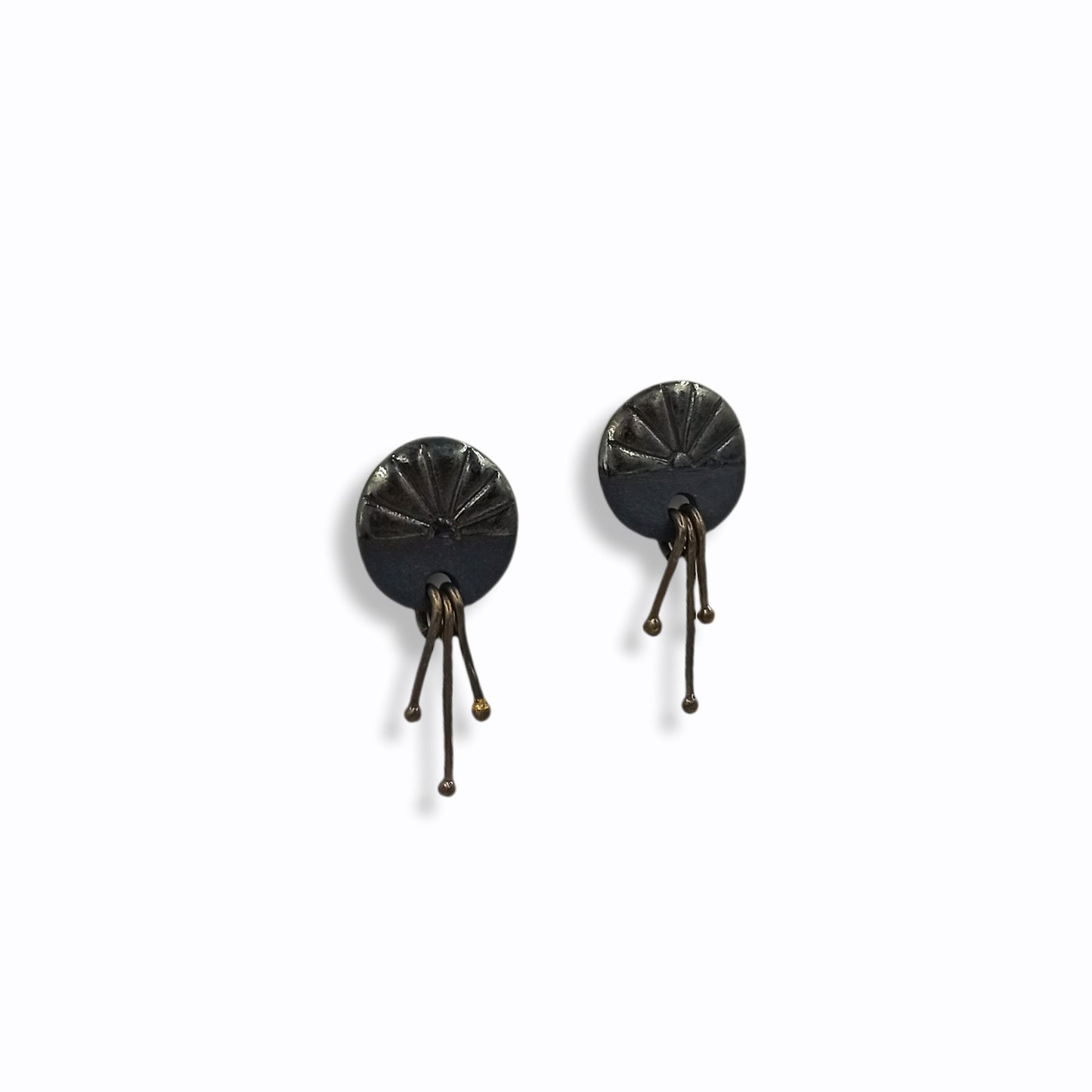 Handmade stud earrings from black porcelain with brass wires that hangs