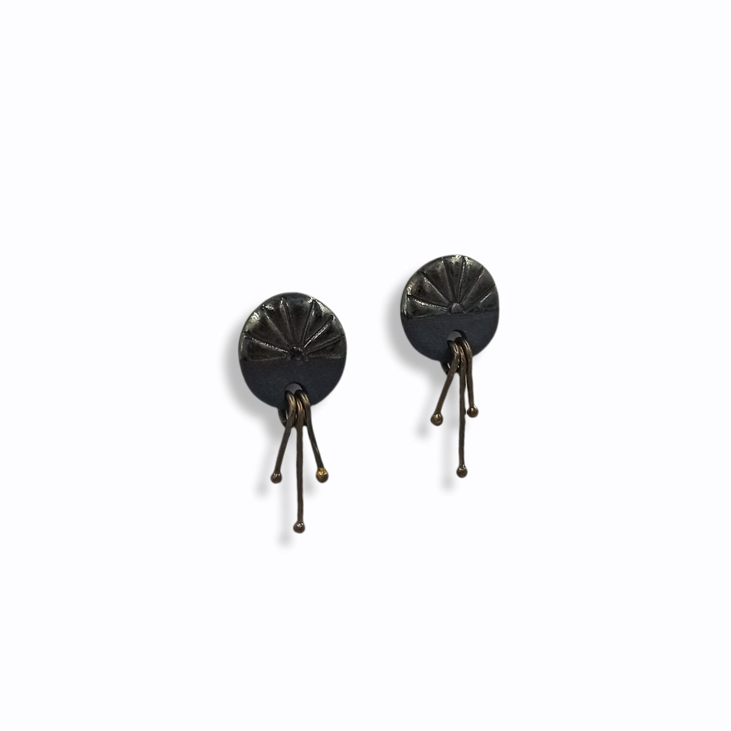 Handmade stud earrings from black porcelain with brass wires that hangs