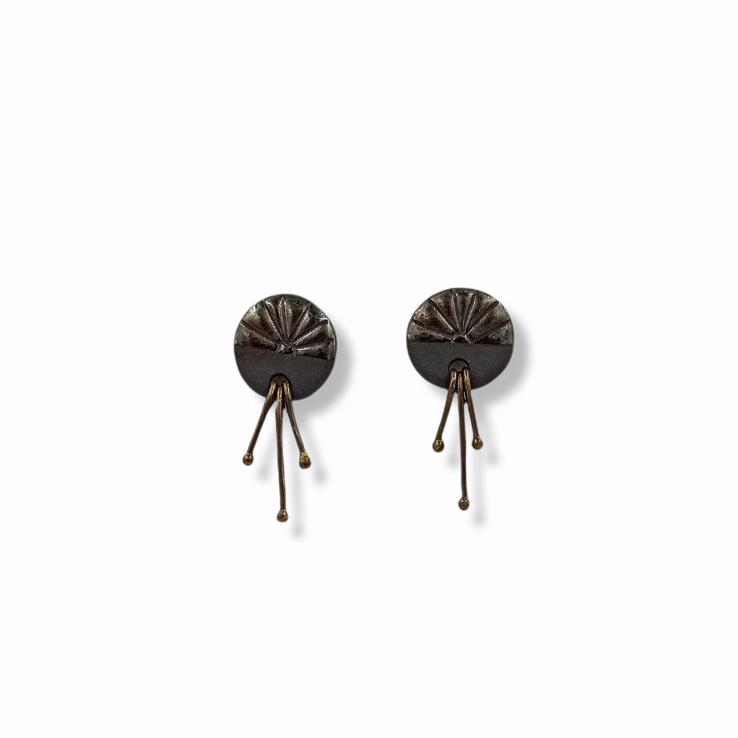 Handmade stud earrings from black porcelain with brass wires that hangs