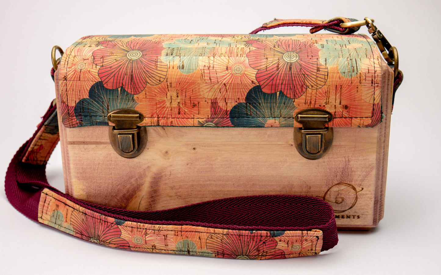 An Eco-Friendly wooden handmade crossbody bag with flower pattern cork leather.